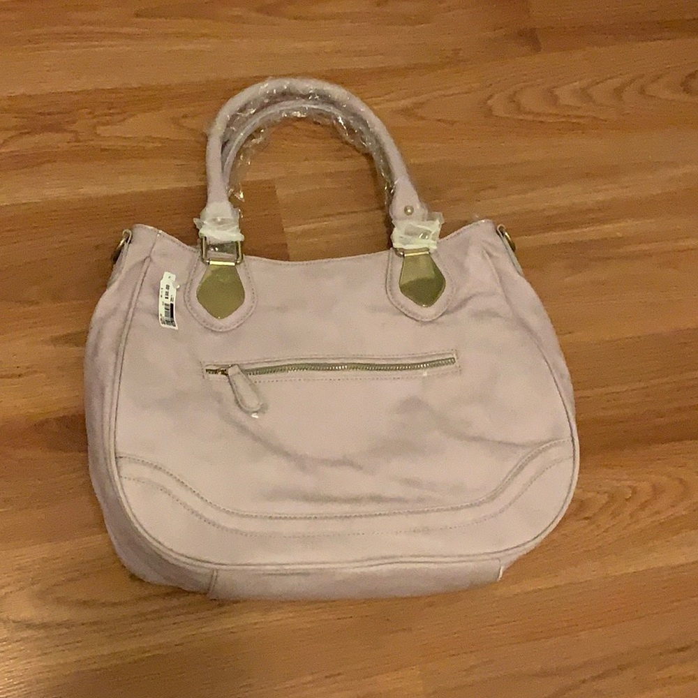This is a light lavender semi oval strap bag